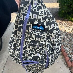 Kavu Black and White Patterned Sling Bag with Lavender Accents